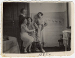 Portrait of four women in a home in Zetel.

Shanke Minuskin is pictured in the center with three friends.