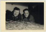 Suse and Kate Grunbaum lie in an attic storeroom at the home of Bernard and Mina Hartemink in Sinderen, the Netherlands, where she was hidden during the war.