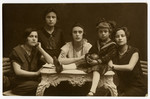 Studio portrait of five Polish Jewish children and teenagers.