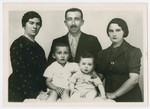 Sandor and Ilona Seidenfeld pose with Ilona's step-mother Yudel (far left)  and their sons Ezra and Mordche.