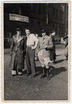 Three Jewish men pose under a Zionist banner in the Landsberg displaced persons' camp.