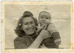 Close-up portrait of a mother and her newborn son in the Wilhelmshaven displaced persons' camp where they were sent after the forced return of the Exodus passengers.