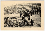 American soldiers force German civilians to bury corpses in the Nordhausen concentration camp.