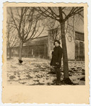 Sala Perec, a young Polish Jewish survivor, stands next to a tree outside the children's home in Dornstadt.