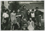 David Marcus poses with Jewish children in Marquain, Belgium.