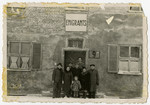 Jewish displaced persons pose in front of the emigration office in Bamberg.
