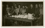 Women sort linens in the Bamberg displaced persons camp.