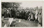 Displaced persons gather for a funeral.