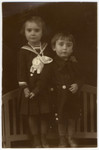 Studio portrait of two Jewish siblings in Sighet, both of whom perished in the Holocaust.