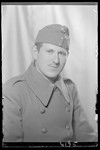 Studio portrait of  Bela Fischer in a military uniform.