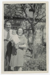 Louis and Engelien Baars pose outside with their infant daughter Ineke soon after their liberation.