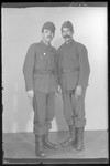 Studio portrait of Sica Salamon and another man, both in military uniform.