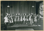 Girls in a French elementary school perform a Christmas pageant.