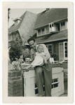 Harry Straus poses with his newborn daughter Hetty.
