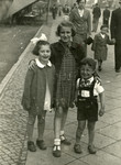 Cousins of Zvi Grundman, Hinde and Zvi pose on a street in Katowice.