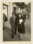 Marcel Hodak walks down a street in Paris with his ousin Eva Pelc.