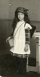 Herta Mayer poses with her book bag on her first day of school.