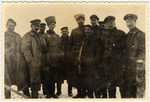 German and Russian soldiers pose together after the end of hostilities on the eastern front during World War I.