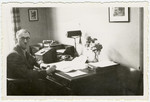 Erwin Heilbronner works at his desk in the welfare department of the Jewish community of Mannheim.