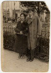 Portrait of a young couple standing on a street in either Eisiskes or Vilna.