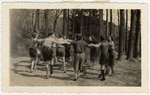 Zionist youth dance a hora in the woods in Switzerland.