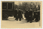 A funeral procession follows a hearse carrying the body of Freida Albin.