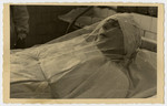 Freida Albin lies in her shrouds after the completion of her tahara (ritual purification).