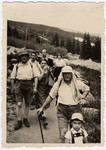 A Bulgarian Jewish family goes for a hike in a forest.