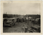 Trucks and ambulances line up to evacuate survivors of the Nordhausen concentration camp.