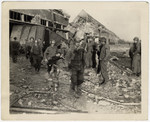 American medics evacuate survivors from the rubble of the Nordhausen concentration camp.