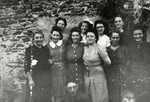 Nine women and a girl pose outside a building. 

Pictured second from the left is Rosa Moses, mother of the donor.