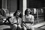Celia Century, a Jewish refugee from Norway, sits a the deck of a summer camp in Ronneby Sweden next to a non-Jewish friend.
