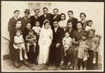 Wedding portrait of an extended Jewish family in Greece.