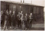 A group of survivors of the Hanover-Ahlem concentration camp gather outside of the infirmary.