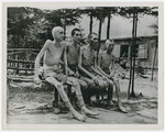 Group portrait of emaciated survivors of the Ebensee concentration camp.