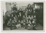 Group portrait of young children in a school in the Schlachtensee displaced persons camp.