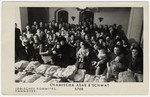 Jewish men, women and children celebrate Tu B'Shvat in the Hanover displaced persons camp.