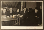 Staff of the Jewish Refugee Aid Committee of Antwerp meet with newly arrived refugees.