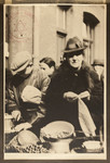 A woman receives food from the Jewish Refugee Aid Committee of Antwerp.