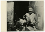 Piroska Vjecsner feeds chickens outside her home in Kremnica.