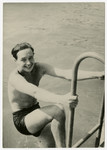 Janos (Hansi) Vjecsner climbs out of a swiming pool.