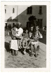 Young children and their adult caretakers pose for a photograph at the children's home of Chateau de la Hille.