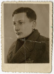 Studio portrait of Moshe Szeps (a friend of the donor) wearing a Jewish star in the Dabrowa ghetto.