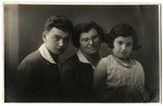 Portrait of the Elkes family in prewar Kaunas.

Miriam Elkes is flanked by her two children, Joel and Sarah.