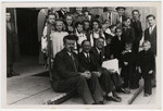 Group portrait of children and adults awaiting repatriation from Berlin to the American Zone.