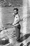Close-up portrait of Dunn, an Irish prisoner, drying off near the river at the Im Fout labor camp in Morocco.
