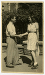 Oscar Kalmar and Edith Weiss Spiegel, both Jews hiding in Budapest, shake hands.