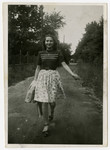 Edith Weiss Spiegel walks down a country road shortly after liberation.