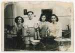 Members of the Holzhausen kibbutz hachshara cook in the camp kitchen.