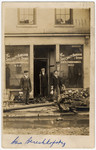Sam (Zalman) Bereshkovsky helps clean up some rubble outside a store in Dayton, OH.